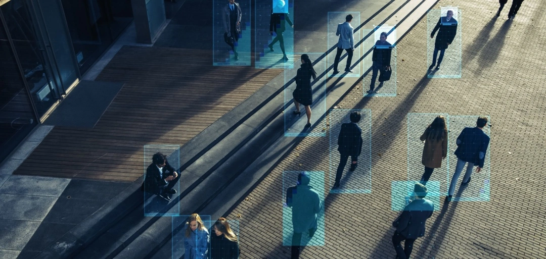 Ecamsecurity Surveillance Solutions for Enhanced Public Safety Overhead view of people with highlighted detection boxes, illustrating Ecamsecure's advanced security monitoring capabilities.